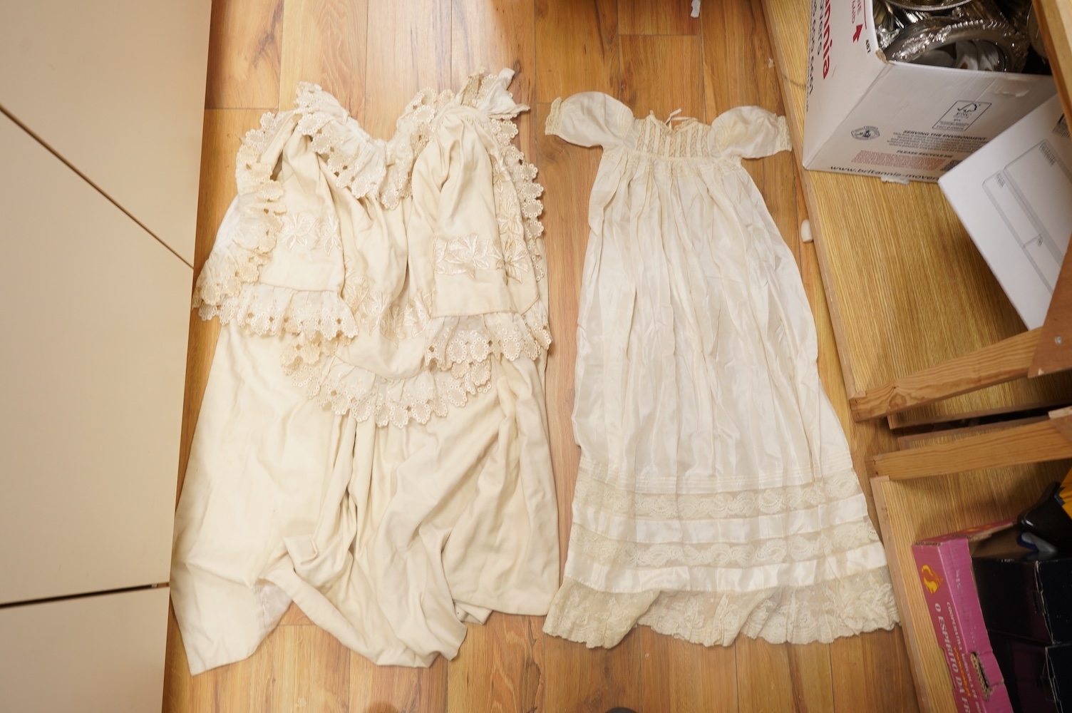 A 19th century cream wool lace and embroidered christening cape and silk baby gown, cape 102cm long. Condition - some stains